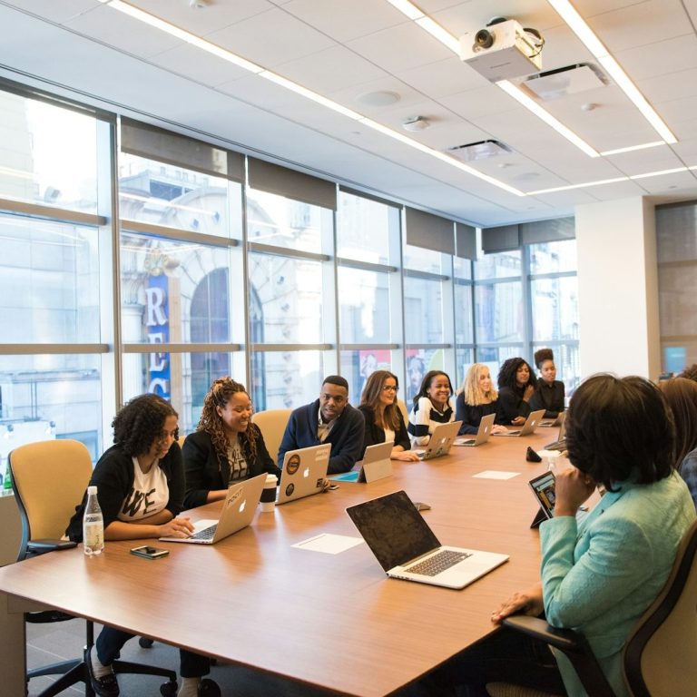 A diverse group of professionals collaborating around a conference table.
